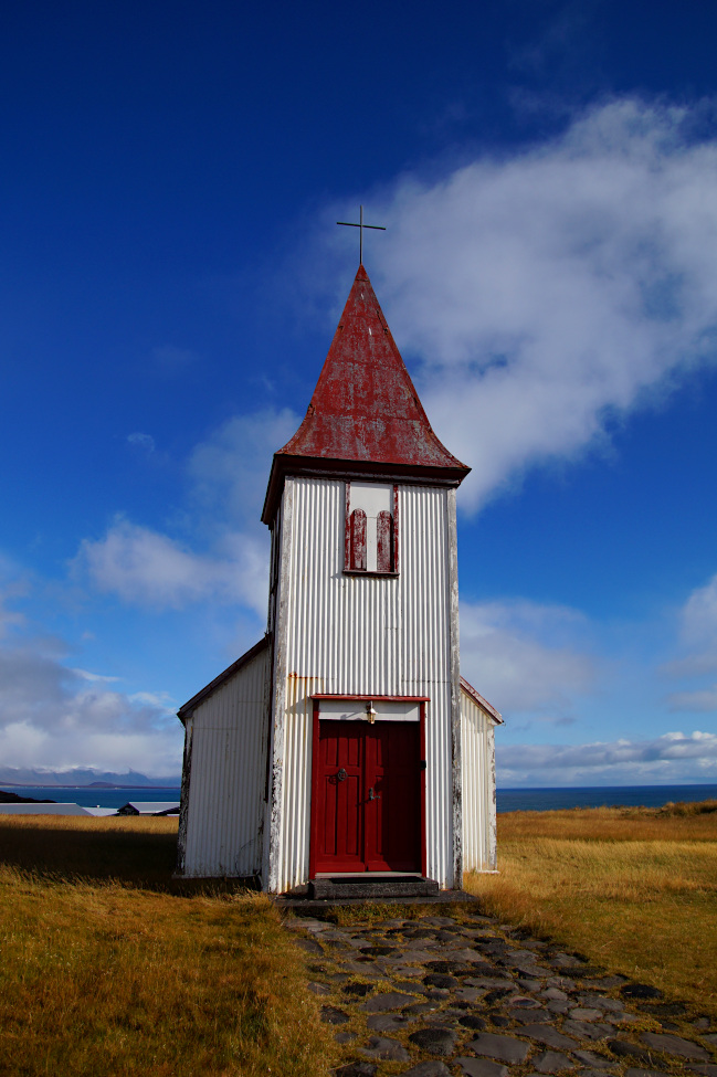 Red and white church in Hellnar