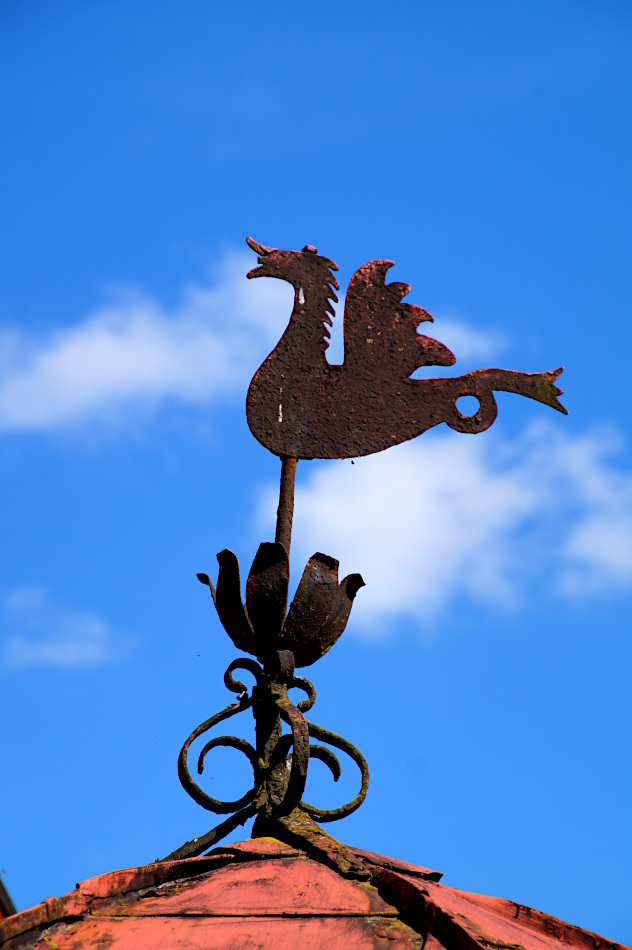 weather vane in the shape of a dragon on top of the roof of the pump house, Vallby Open Air Museum